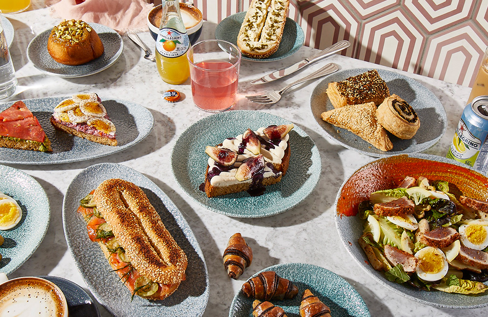 A selection of dishes and treats laid out on a table.